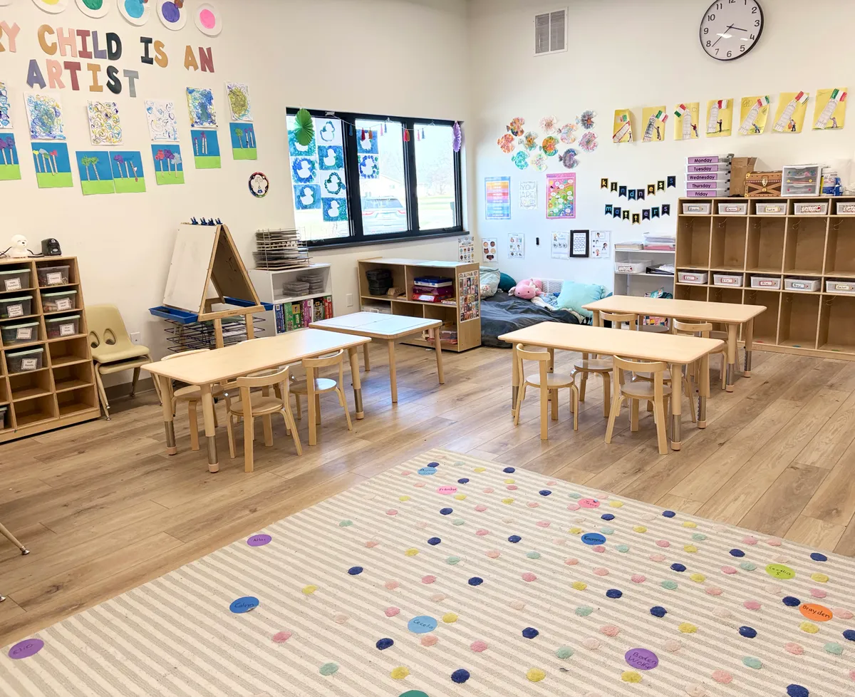 Inside a Spark Academy classroom — organized learning stations, child-sized furniture, and student artwork on display