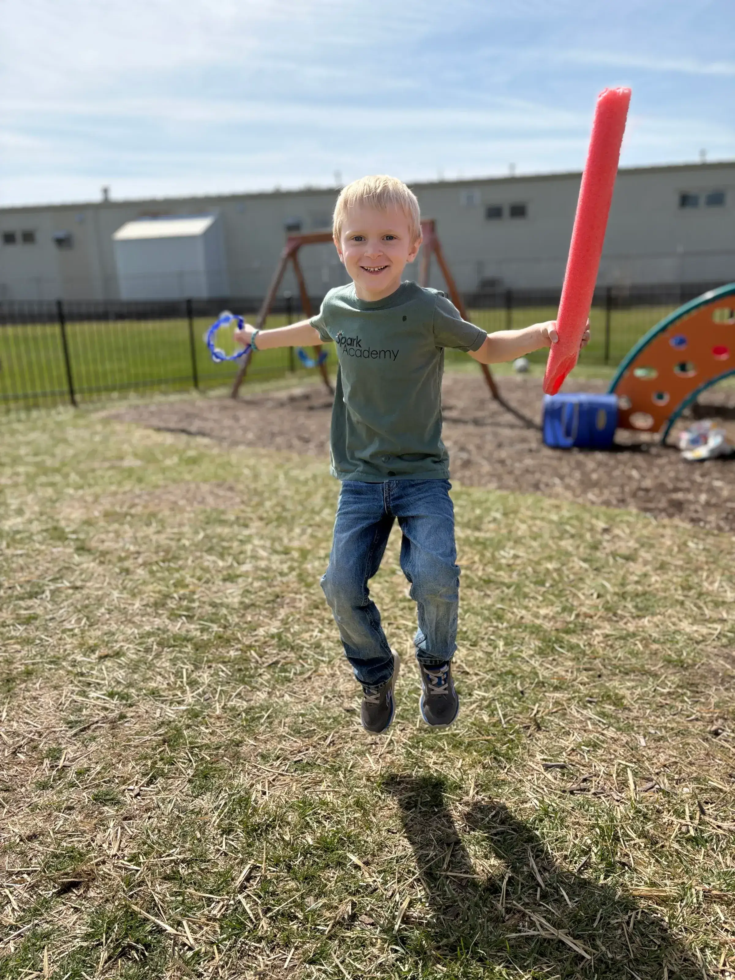 School-age children engaged in a creative after-school activity at Spark Academy