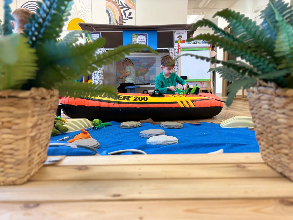 Four-year-old children collaborating in the Developmental Playroom at Spark Academy