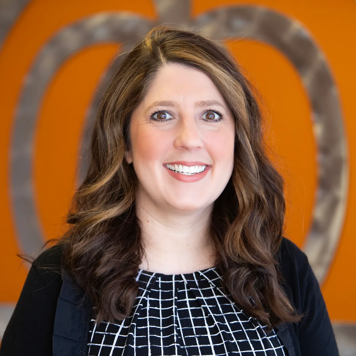 Dr. Michelle Peterson leading a tour at Spark Academy preschool