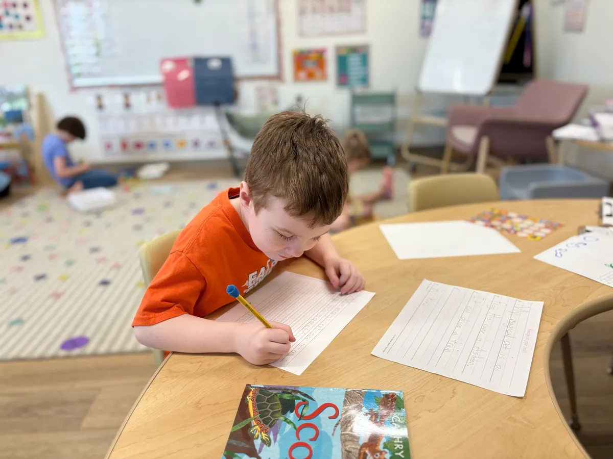 Spark Academy teacher working one-on-one with a kindergarten student