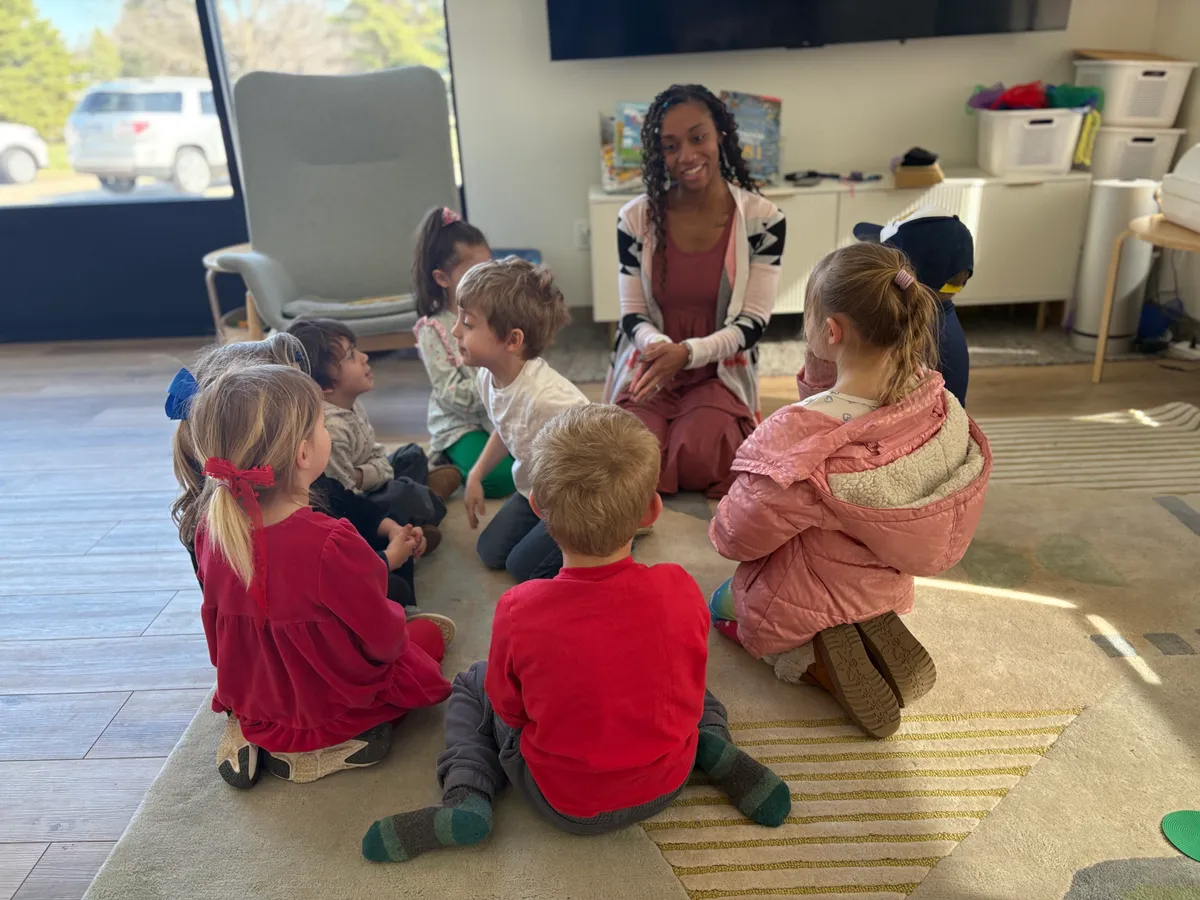 Teacher and children gathered for circle time at Spark Academy — a glimpse of a typical morning